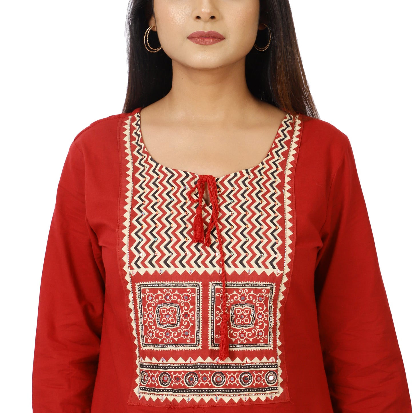 Detailed embroidery on red kurta neckline and dupatta