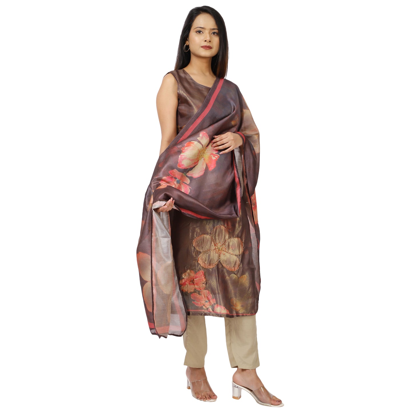 Woman wearing a floral saree with a plain background