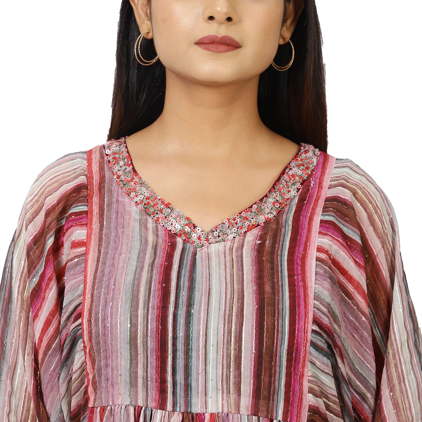 Model wearing pink and grey striped kurta set styled with palazzo pants